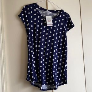 Navy blue and white polka dot shirt.